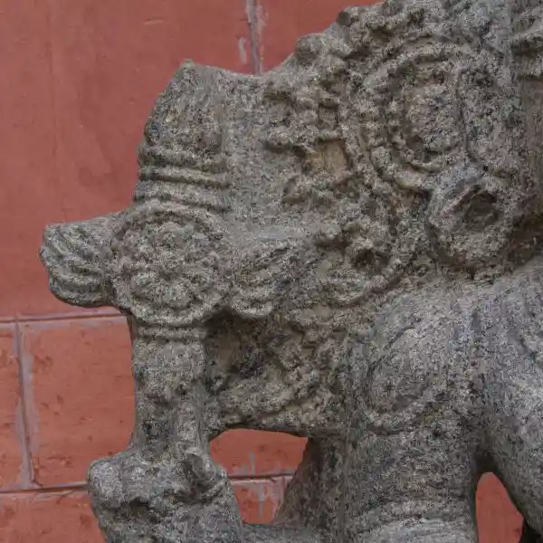 Statue of an Indian god, cross with solar disc